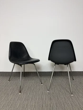 Authentic vintage Herman Miller Eames fibreglass shell chairs with leather cover